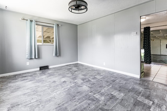 317 Highland Dr, Tooele, UT 84074 - empty room with wood finished floors and a textured ceiling