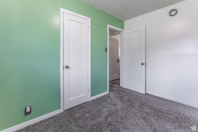 317 Highland Dr, Tooele, UT 84074 - unfurnished bedroom with carpet flooring and a textured ceiling