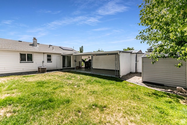 317 Highland Dr, Tooele, UT 84074 - back of property with a yard, a storage shed, and a patio