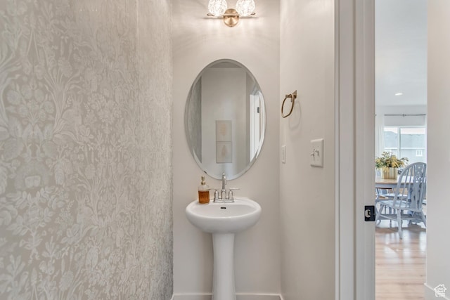 7256 N Green Pasture Ln, Eagle Mountain, UT 84005 - bathroom featuring a chandelier and baseboards