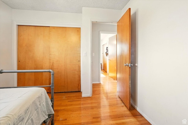 2280 N 800 E, North Logan, UT 84341 - bedroom with light wood-style floors and a textured ceiling