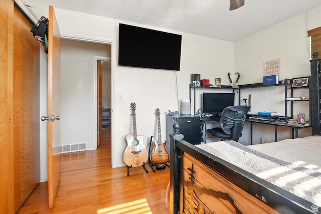 2280 N 800 E, North Logan, UT 84341 - bedroom featuring wood finished floors and a textured ceiling