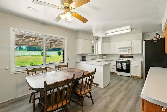 2280 N 800 E, North Logan, UT 84341 - kitchen with white appliances, plenty of natural light, white cabinetry, and light countertops