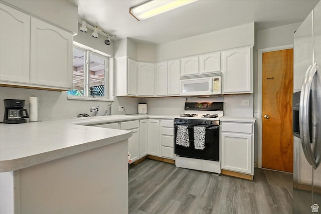 2280 N 800 E, North Logan, UT 84341 - kitchen with white appliances, wood finished floors, white cabinets, and light countertops