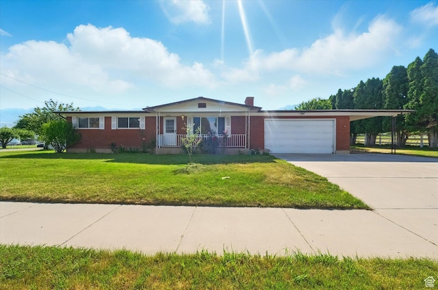 2280 N 800 E, North Logan, UT 84341 - ranch-style home featuring an attached garage, a porch, concrete driveway, a front yard, and brick siding