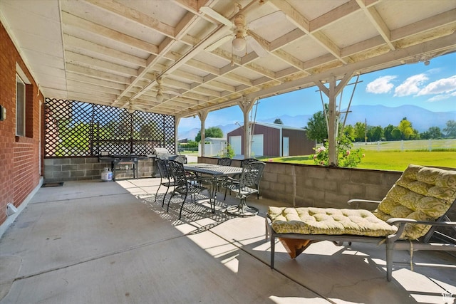 2280 N 800 E, North Logan, UT 84341 - view of patio / terrace featuring outdoor dining space, a mountain view, an outdoor structure, ceiling fan, and a grill