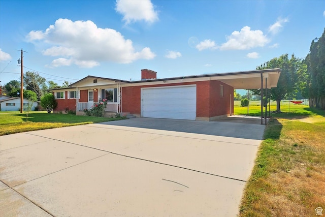 2280 N 800 E, North Logan, UT 84341 - view of front facade featuring a front lawn, driveway, brick siding, a chimney, and a garage