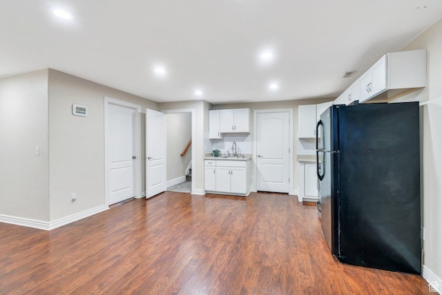 215 N Bald Mountain Dr E, Alpine, UT 84004 - kitchen with freestanding refrigerator, white cabinets, recessed lighting, tasteful backsplash, and dark wood finished floors