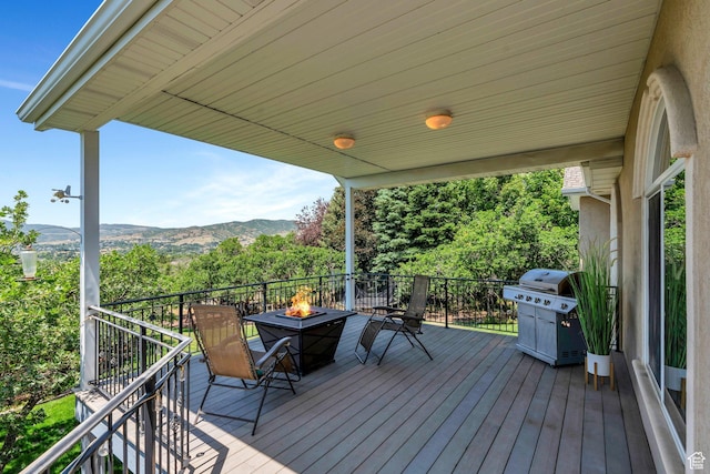215 N Bald Mountain Dr E, Alpine, UT 84004 - wooden terrace with a fire pit, a grill, and a mountain view