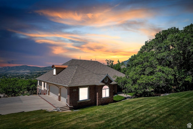 215 N Bald Mountain Dr E, Alpine, UT 84004 - view of side of property featuring brick siding, a garage, a lawn, and concrete driveway