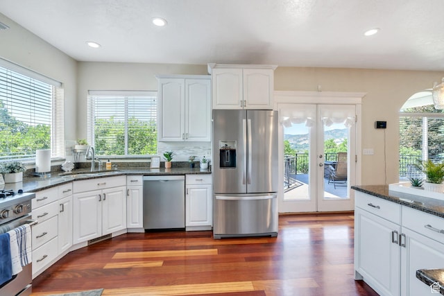 215 N Bald Mountain Dr E, Alpine, UT 84004 - kitchen featuring appliances with stainless steel finishes, plenty of natural light, french doors, dark wood-type flooring, and recessed lighting