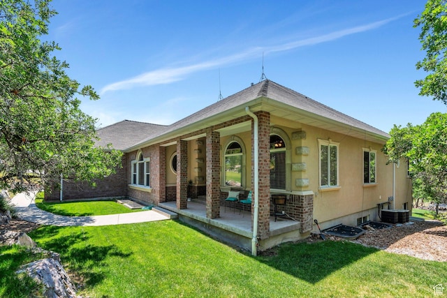 215 N Bald Mountain Dr E, Alpine, UT 84004 - rear view of house with a lawn, brick siding, and roof with shingles