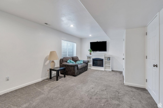 2459 E Ox Yoke Dr S, Eagle Mountain, UT 84005 - carpeted living area with a glass covered fireplace and recessed lighting