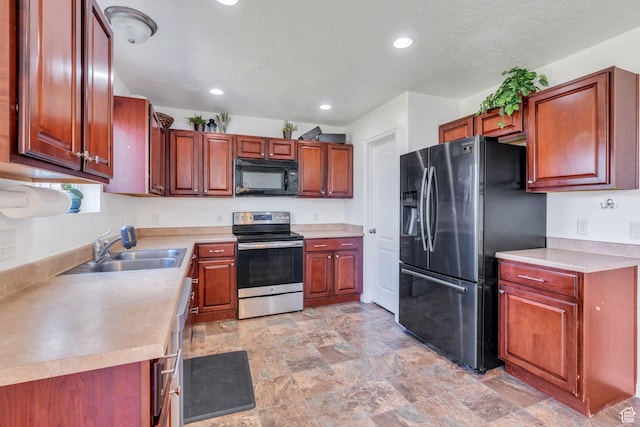 2459 E Ox Yoke Dr S, Eagle Mountain, UT 84005 - kitchen featuring stainless steel appliances, recessed lighting, light countertops, and stone finish floors