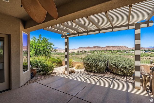 1410 W Ambassador Dr, St George, UT 84790 - view of patio with a mountain view and a pergola