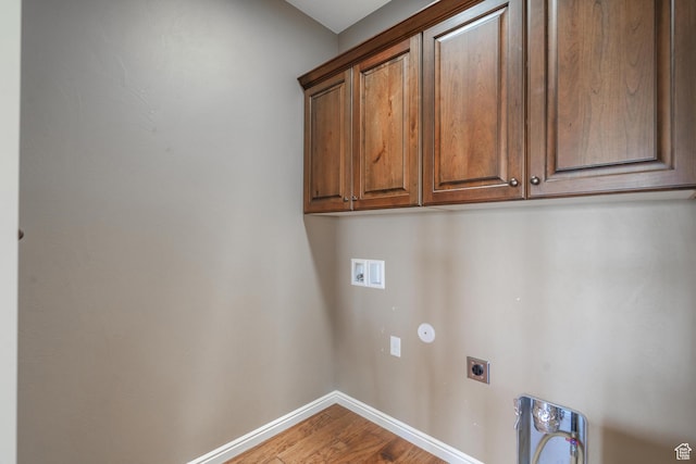 1410 W Ambassador Dr, St George, UT 84790 - laundry room featuring hookup for an electric dryer, cabinet space, wood finished floors, and washer hookup