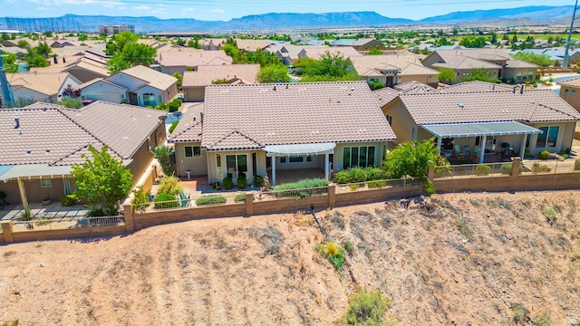1410 W Ambassador Dr, St George, UT 84790 - aerial perspective of suburban area with a mountainous background