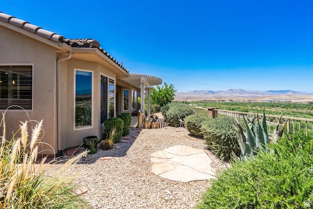 1410 W Ambassador Dr, St George, UT 84790 - view of yard featuring a mountain view and a pergola