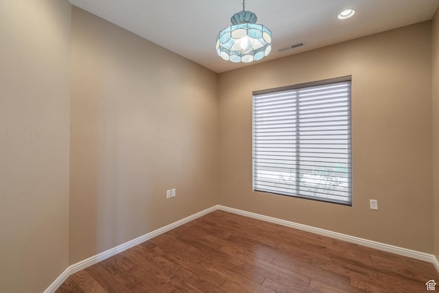 1410 W Ambassador Dr, St George, UT 84790 - unfurnished room with wood finished floors, recessed lighting, and a chandelier
