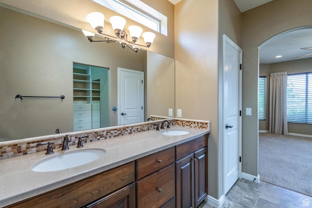 1410 W Ambassador Dr, St George, UT 84790 - bathroom featuring double vanity, a closet, and a chandelier