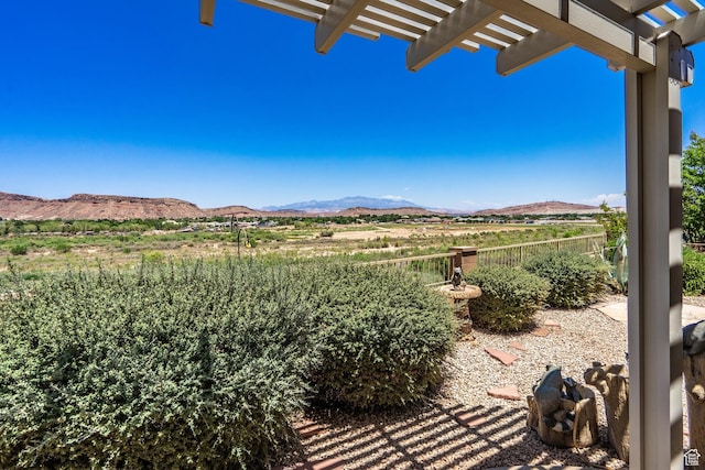 1410 W Ambassador Dr, St George, UT 84790 - view of patio featuring a mountain view and a pergola