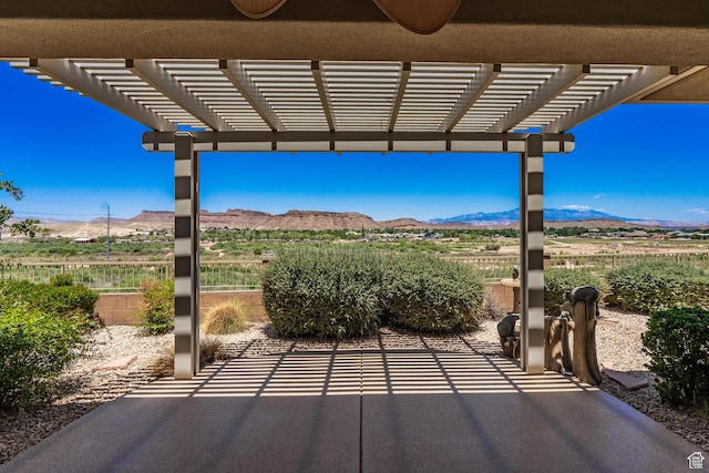 1410 W Ambassador Dr, St George, UT 84790 - view of patio featuring a mountain view and a pergola