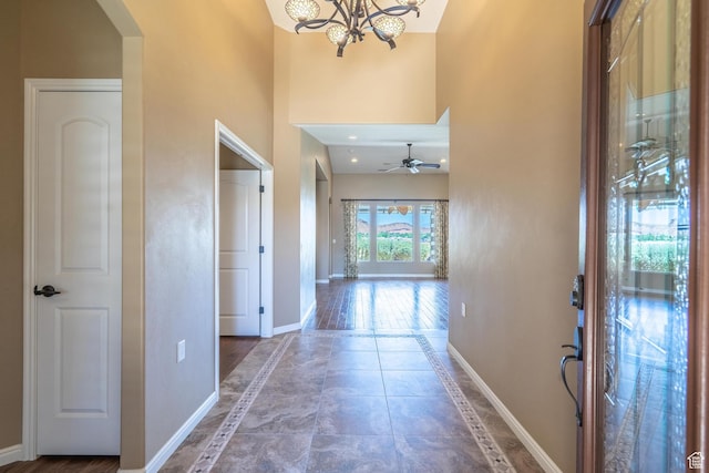 1410 W Ambassador Dr, St George, UT 84790 - hall with inlaid floor details, arched walkways, a high ceiling, and a chandelier