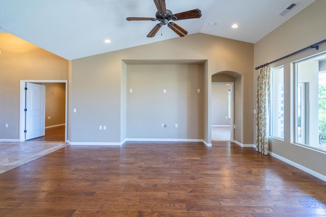1410 W Ambassador Dr, St George, UT 84790 - empty room featuring arched walkways, lofted ceiling, ceiling fan, wood finished floors, and recessed lighting