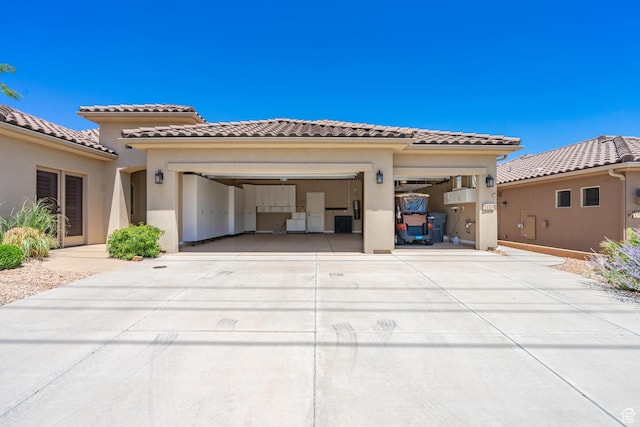 1410 W Ambassador Dr, St George, UT 84790 - mediterranean / spanish house featuring driveway, a garage, stucco siding, and a tile roof