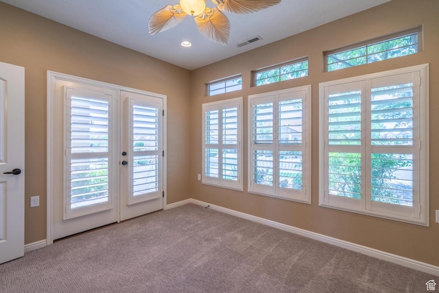 1410 W Ambassador Dr, St George, UT 84790 - unfurnished room featuring carpet flooring, plenty of natural light, french doors, and ceiling fan