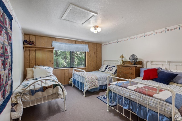 6907 E Mt Aire Rd, Salt Lake City, UT 84109 - bedroom with a textured ceiling, wooden walls, carpet flooring, and attic access