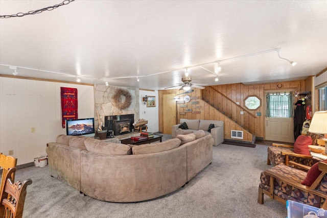 6907 E Mt Aire Rd, Salt Lake City, UT 84109 - living area featuring wood walls, track lighting, light colored carpet, a ceiling fan, and stairs