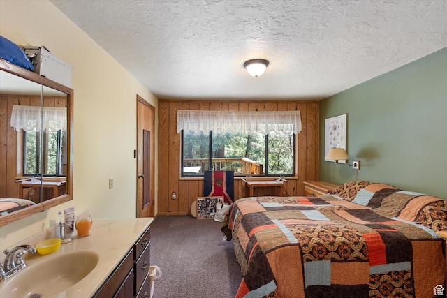 6907 E Mt Aire Rd, Salt Lake City, UT 84109 - bedroom featuring carpet floors, a textured ceiling, and wood walls