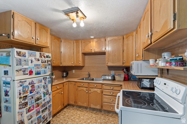 6907 E Mt Aire Rd, Salt Lake City, UT 84109 - kitchen with white appliances, light countertops, a textured ceiling, and light flooring