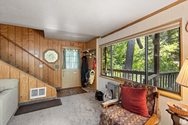 6907 E Mt Aire Rd, Salt Lake City, UT 84109 - foyer featuring carpet flooring, wood walls, and stairs