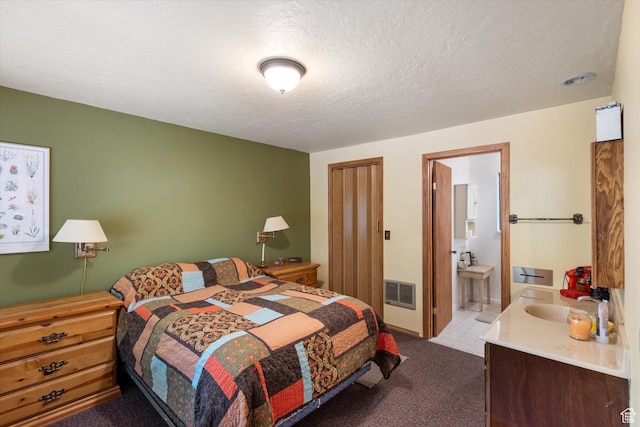 6907 E Mt Aire Rd, Salt Lake City, UT 84109 - carpeted bedroom featuring ensuite bathroom and a textured ceiling