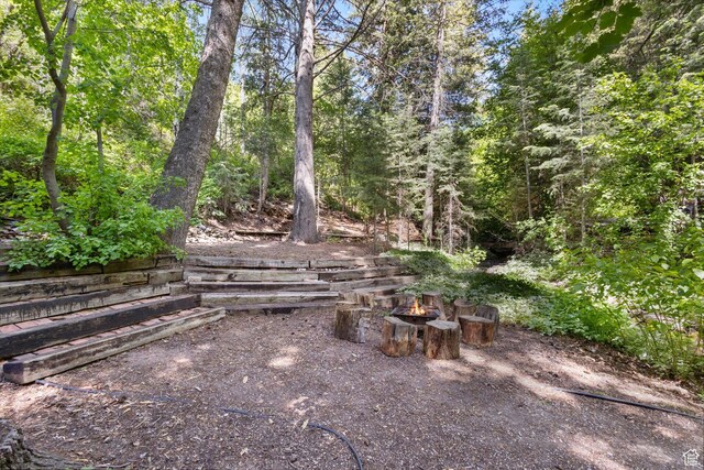 6907 E Mt Aire Rd, Salt Lake City, UT 84109 - view of yard featuring a fire pit