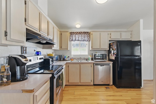 22 E Main St S, Eureka, UT 84628 - kitchen featuring appliances with stainless steel finishes, under cabinet range hood, light countertops, and light brown cabinetry