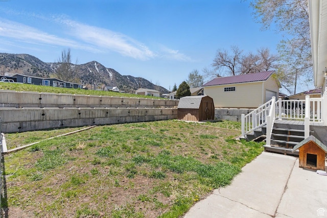 22 E Main St S, Eureka, UT 84628 - fenced backyard with a shed and a deck with mountain view