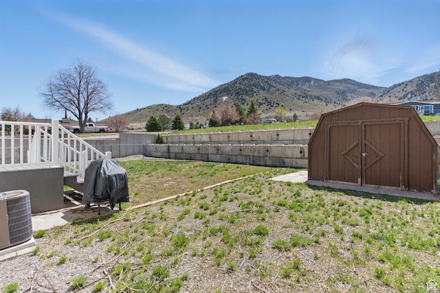 22 E Main St S, Eureka, UT 84628 - fenced backyard featuring a mountain view and a storage unit