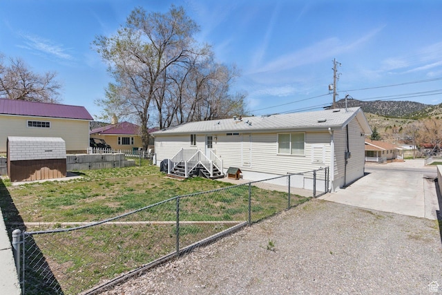 22 E Main St S, Eureka, UT 84628 - back of house featuring a fenced backyard and a storage unit