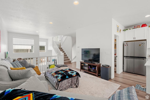 15129 S Halter Way, Bluffdale, UT 84065 - living room featuring light wood-type flooring, recessed lighting, and stairway