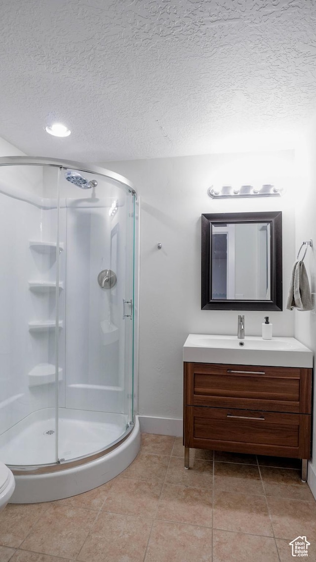15113 S Bright Stars Dr, Bluffdale, UT 84065 - full bath featuring vanity, a shower stall, a textured ceiling, and tile patterned floors