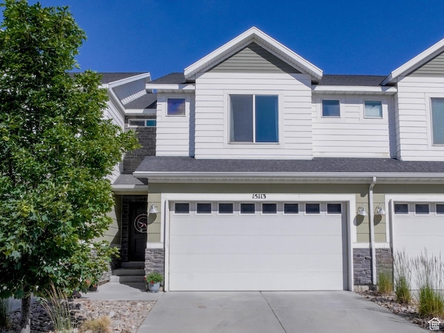 15113 S Bright Stars Dr, Bluffdale, UT 84065 - view of front of property featuring a garage, stone siding, and concrete driveway