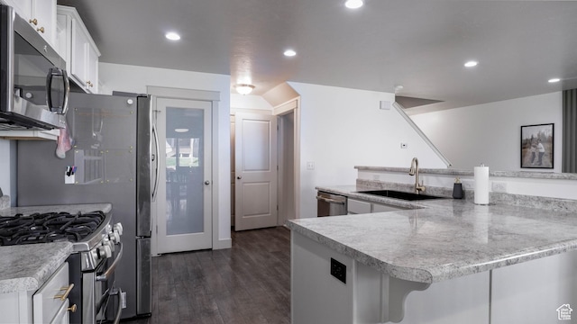 15113 S Bright Stars Dr, Bluffdale, UT 84065 - kitchen featuring appliances with stainless steel finishes, white cabinets, dark wood finished floors, and recessed lighting