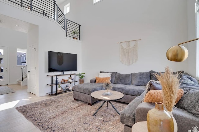 856 S 250 W, American Fork, UT 84003 - living area with a towering ceiling, wood finished floors, and stairs