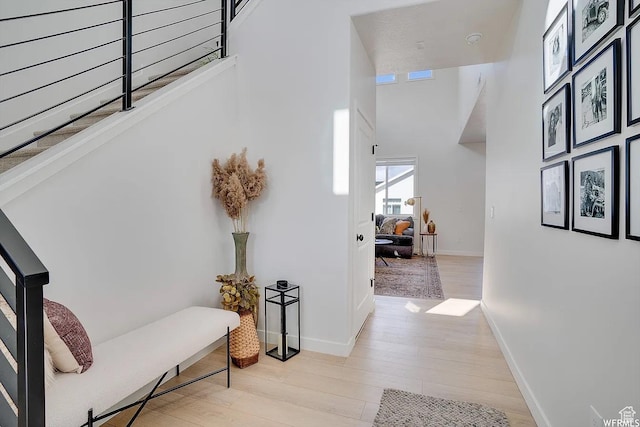 856 S 250 W, American Fork, UT 84003 - hallway with wood finished floors, stairs, and a towering ceiling