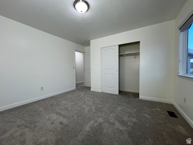 5558 W Dornton Ct, Herriman, UT 84096 - unfurnished bedroom with carpet flooring, a closet, and a textured ceiling
