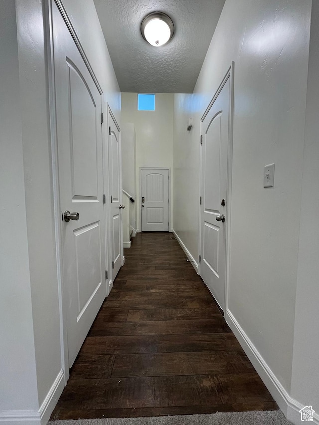 5558 W Dornton Ct, Herriman, UT 84096 - hallway with dark wood-type flooring and a textured ceiling