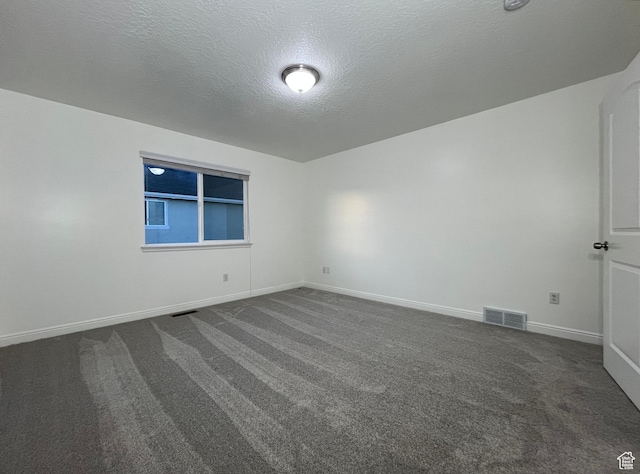 5558 W Dornton Ct, Herriman, UT 84096 - empty room with dark carpet and a textured ceiling